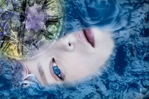 istock Female face immersed in blue water and time 1183037458