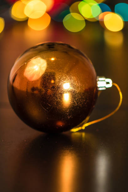 istock Christmas decoration and ornaments. Christmas composition on blurred lights background. Shiny Christmas ball. 1183039077