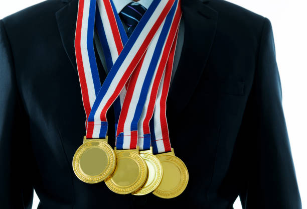 istock Gold medals hanging around a man neck 1183039131