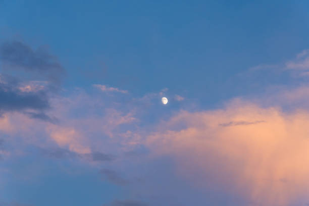 istock Incomplete moon in the sky during sunset at dusk. 1183040011