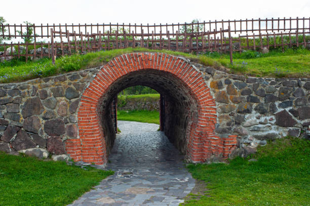 istock brick wall with arch entrance 1183040252
