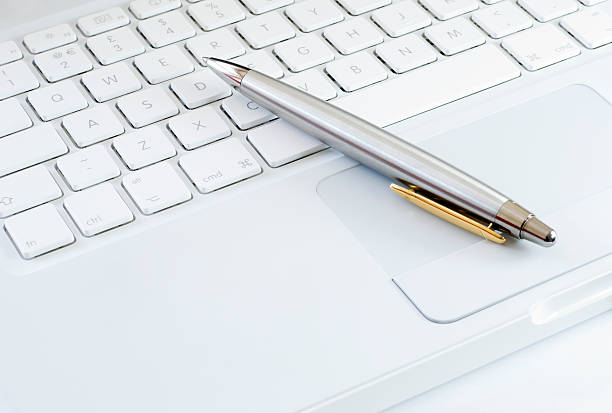 istock Silver pen on a laptop keyboard 118304079
