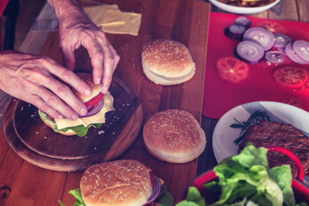 istock Burger making, close up, ingredients at table 1183041151