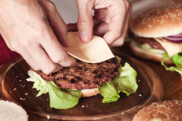 istock Burger making, close up, ingredients at table 1183041154