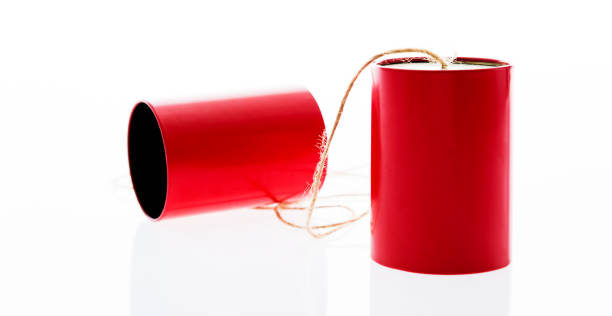 istock Red tin cans phone on white background 1183043234