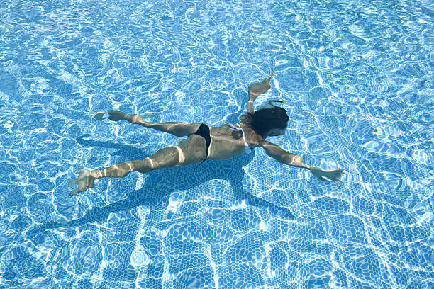 istock Girl Swimming Underwater 118304337