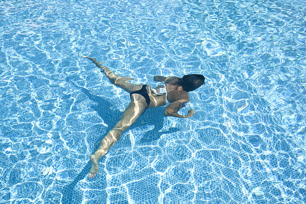 istock Girl Swimming Underwater 118304411