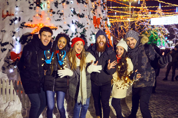 istock A group of people having fun at Christmas night. 1183044554