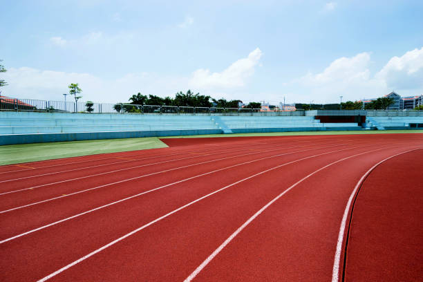 istock Red plastic running track in a playground 1183044887