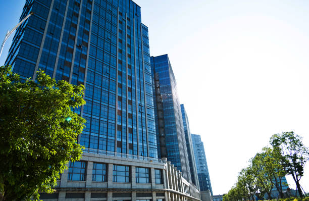 istock Business office buildings and trees 1183046017