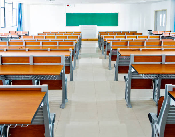 istock Desks and chairs in a lecture hall 1183046077