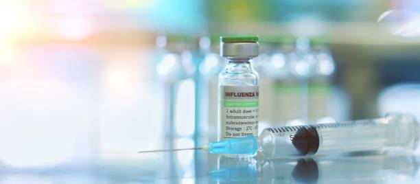 Vaccine vial dose flu shot drug needle syringe,medical concept vaccination hypodermic injection treatment disease care hospital prevention immunization illness disease baby child.blue background stock photo vacuna vial dosis de gripe inyección de la inyección de la jeringa de la aguja de la inyección, concepto médico vacunación inyección hipodérmica tratamiento de la enfermedad de la enfermedad de la prevención del hospital prevención de la enfermeda