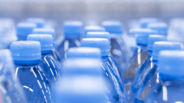 istock Defocus background, clean drinking water in plastic bottles. Blue background wallpaper close-up drinks 1183049088