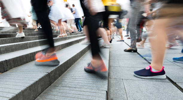 istock Human legs going up the stairs 1183049105