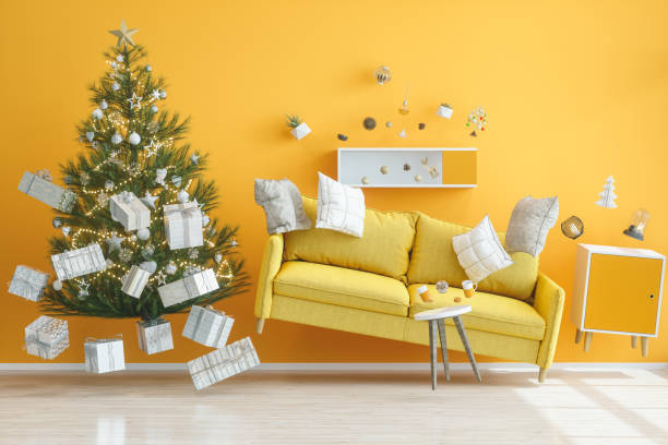 gravity concepts. yellow living room with christmas tree - cair no sofá imagens e fotografias de stock