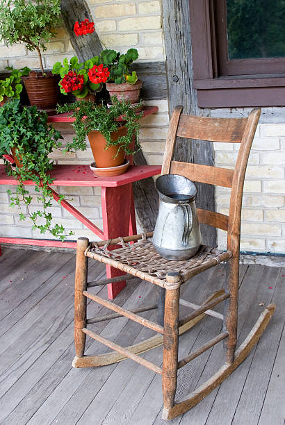 istock old fashioned front porch with chair and plants 118305136