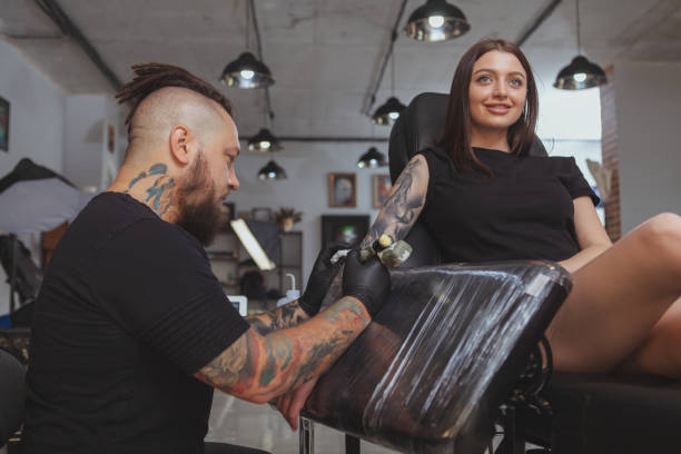 istock Professional tattoo artist working at his studio 1183052135