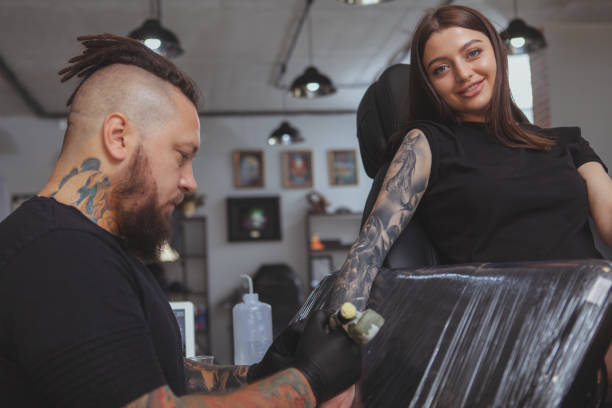 istock Professional tattoo artist working at his studio 1183052152