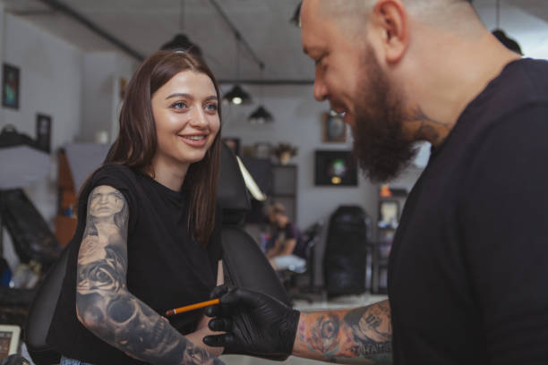 istock Professional tattoo artist working at his studio 1183052189