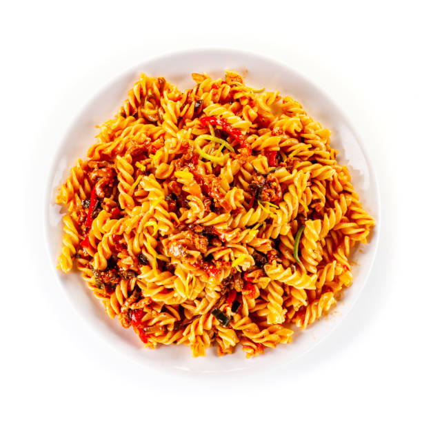 fusilli pasta with meat, marinara sauce and parmesan on white background - pasta directly above fusilli food imagens e fotografias de stock