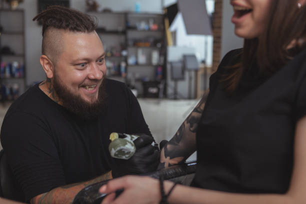 istock Professional tattoo artist working at his studio 1183052225