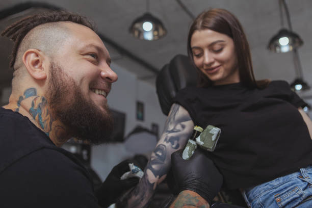 Professional tattoo artist working at his studio