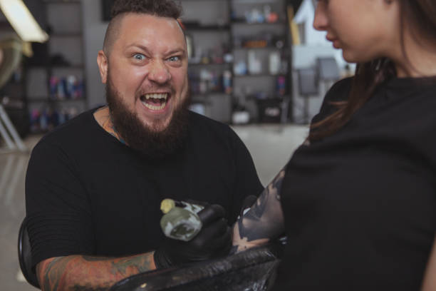 istock Professional tattoo artist working at his studio 1183052253