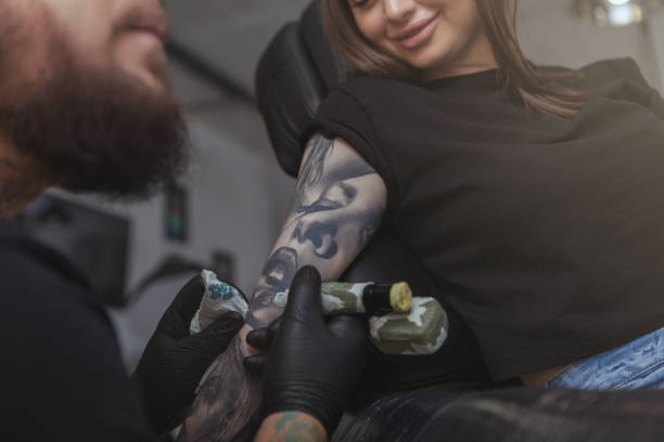 istock Professional tattoo artist working at his studio 1183052266