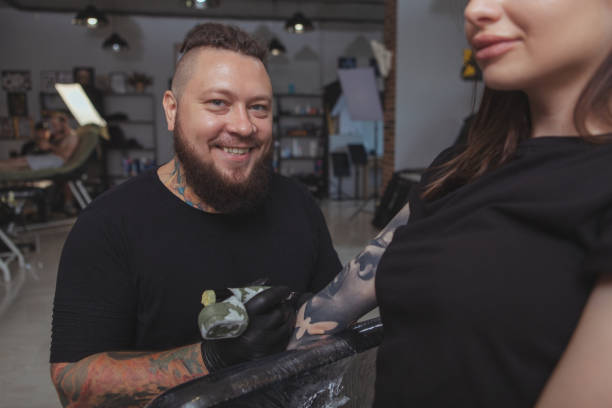istock Professional tattoo artist working at his studio 1183052297