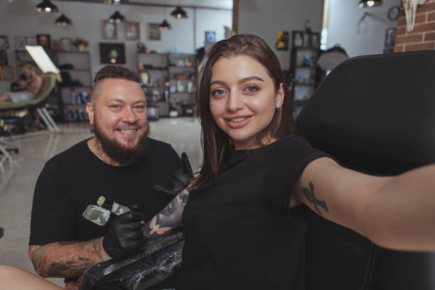 istock Professional tattoo artist working at his studio 1183052302