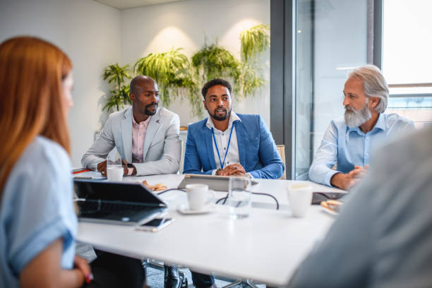 istock African Executive Discussing Ideas with Colleagues 1183053302