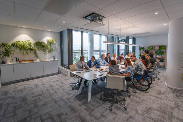 Executive Team Sitting at Conference Table in Board Room