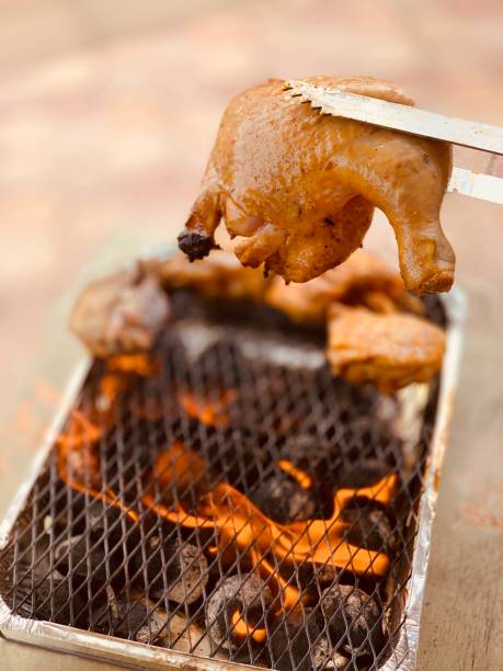 istock the process of cooking chicken thigh on fire 1183053654