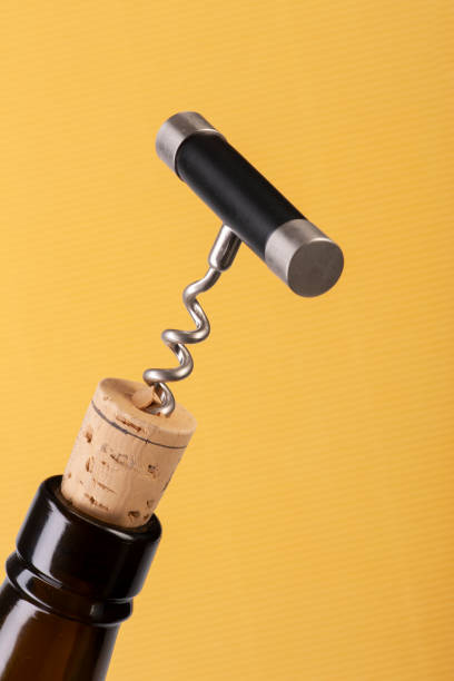istock Corkscrew and wine bottle over yellow background 1183054119