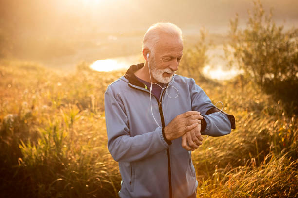 istock Active Senior Man using Smart Watch measuring heart rate 1183055392