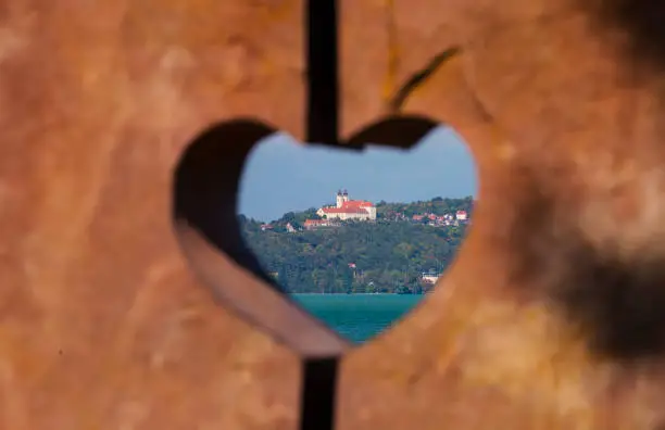 Tihany Abbey benedictine monastery view through heart shape at Lake Balaton, Hungary