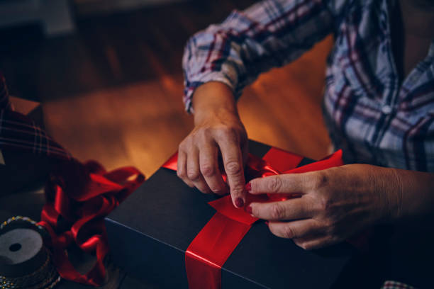 istock Wrapping and Decorating Christmas Presents 1183057336