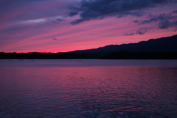 Beautiful sunset observed at Lake Kamo, Sado island, in autumn Niigata,Japan-October 20, 2019: Beautiful sunset observed at Lake Kamo, Sado island, in autumn Sado stock pictures, royalty-free photos & images