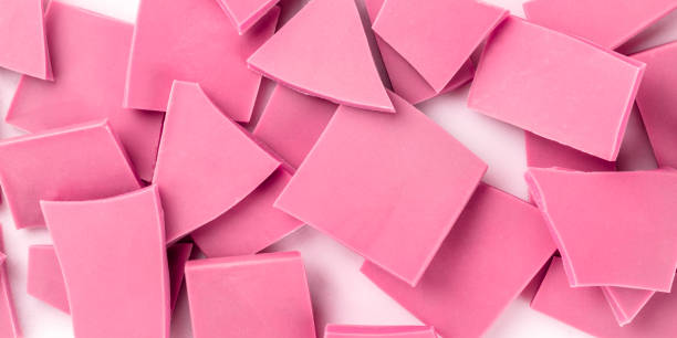 istock A panorama of ruby chocolate slices, overhead shot on a white marble background 1183059641