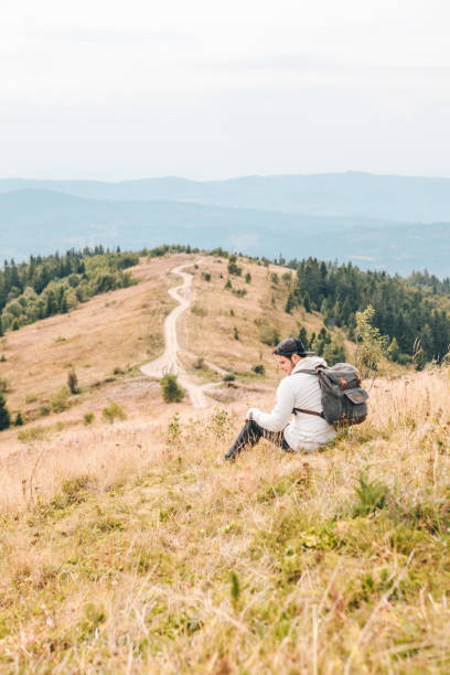 istock man with backpack hiking by autumn mountains copy space 1183061741