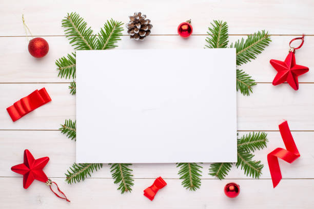 istock Empty paper for greeting text or logo surrounded with Christmas fir branches and decorations. 1183065796