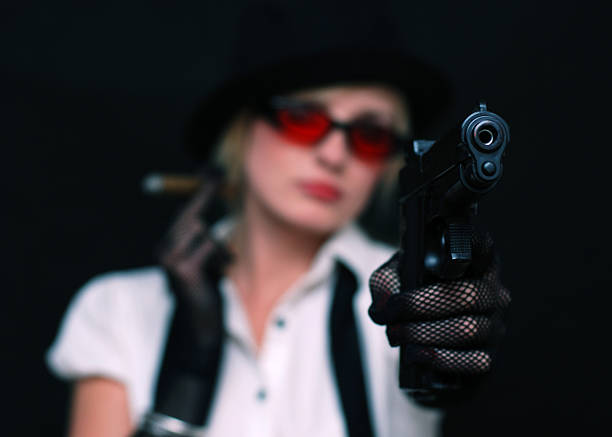 istock Gangster lady holding gun 118306667