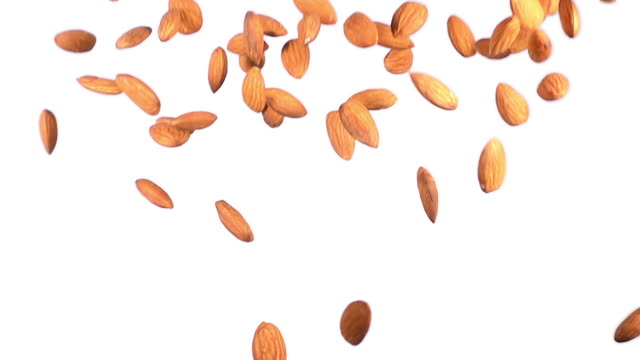 group of almonds flying in slow motion