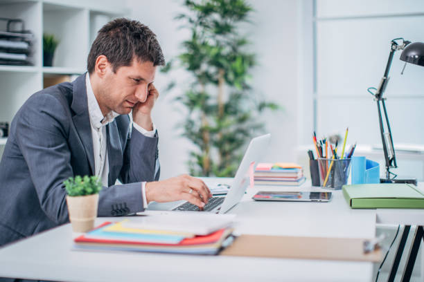 istock Businessman with headache 1183068177