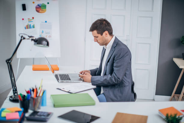 istock Businessman texting on mobile phone 1183068223