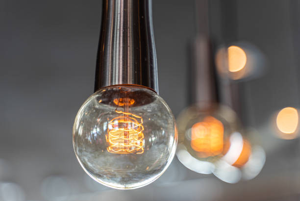 istock Close-Up Of Illuminated Light Bulb 1183068417