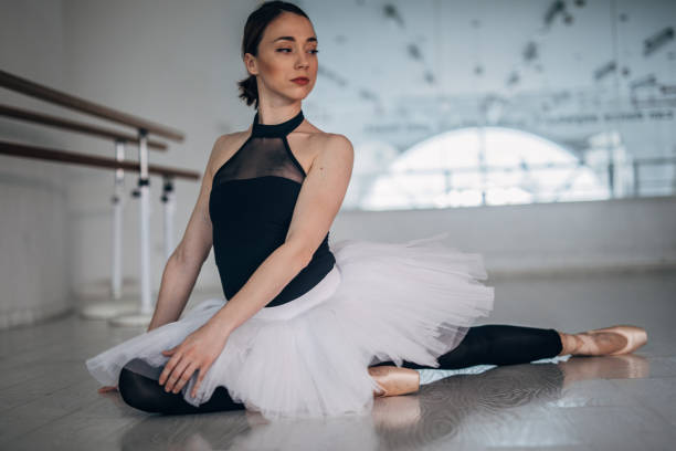 istock Beautiful lady ballerina in dance studio 1183069247