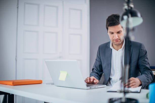 istock Businessman doing paperwork in the office 1183070564