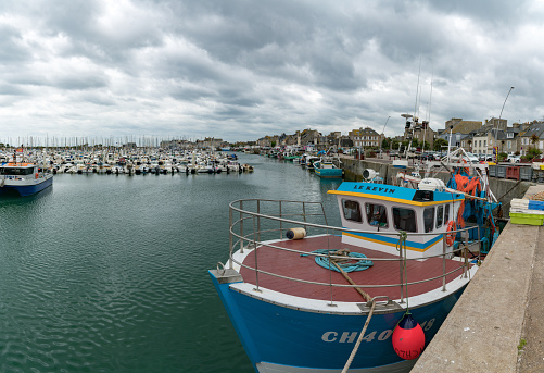 Saint-Vaast-la-Hougue, Manche / France - 16 August, 2019: fishing boats and yacht marina in the harbor of Saint Vaast la Hougue in Normandy