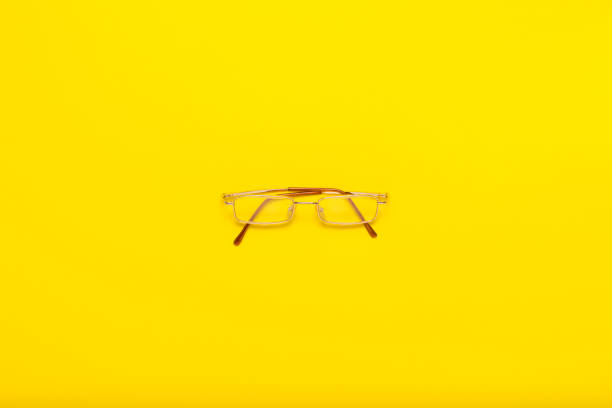 istock Eye glasses on a yellow background. Flat lay, top view 1183070981